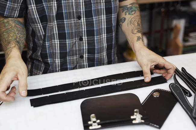 Craftsman at leather workshop — Stock Photo