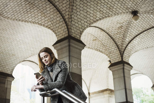 Woman looking smartphone — Stock Photo