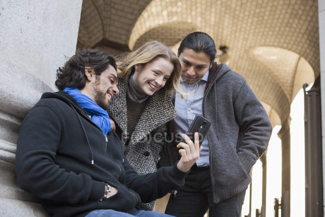 People  looking at screen of smartphone — Stock Photo