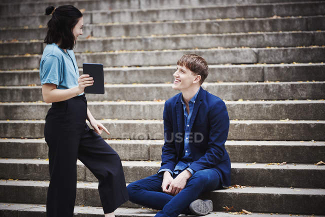 Woman and man on steps — Stock Photo