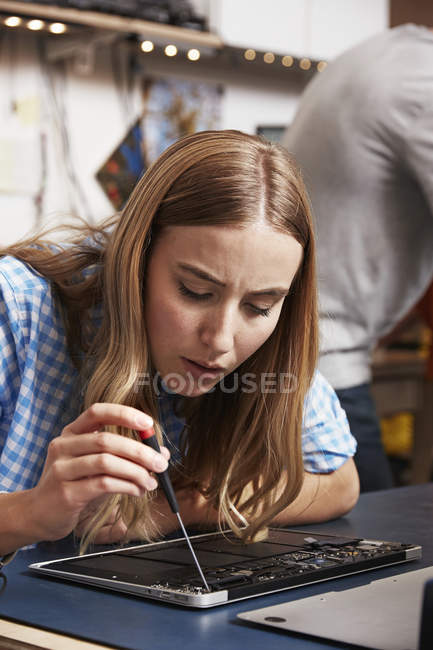 Woman leaning over the circuit board — Stock Photo