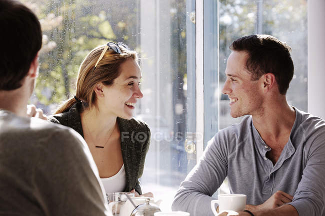 People sitting at cafe — Stock Photo