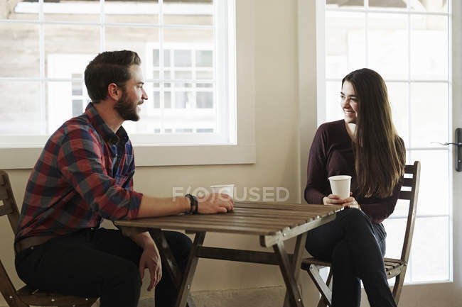 Man and woman in cafe — Stock Photo
