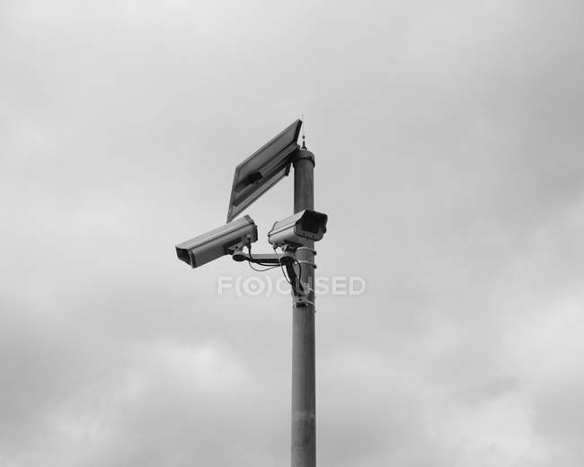 Solar powered surveillance camera — Stock Photo