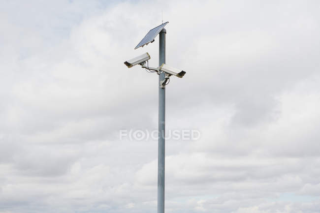 Solar powered surveillance camera — Stock Photo