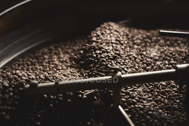 Drum of roasting coffee beans — Stock Photo