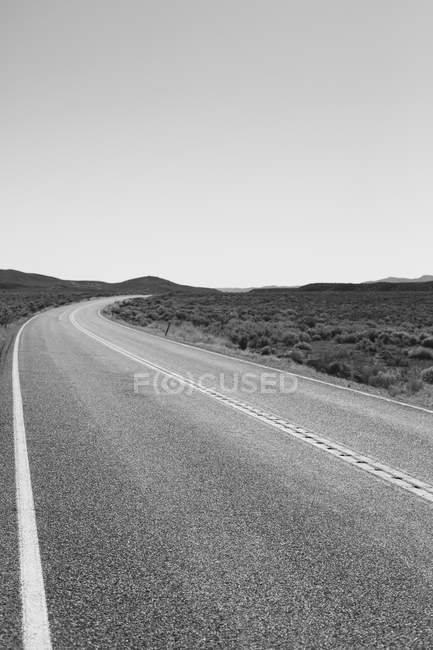 Rural road curving around — Stock Photo