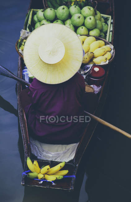 Woman selling goods from boat — Stock Photo