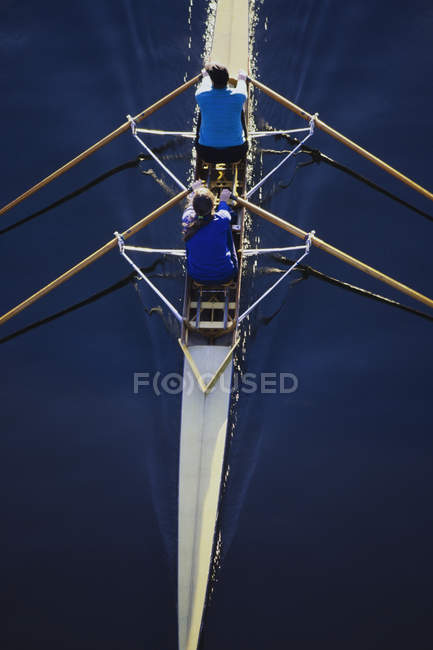 Women rowing double scull boat — Stock Photo