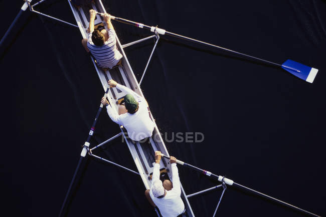 Men rowing scull boat — Stock Photo