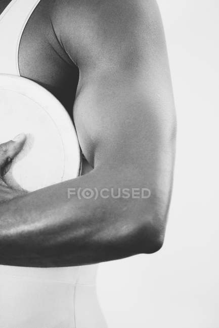Athlete holding discus — Stock Photo