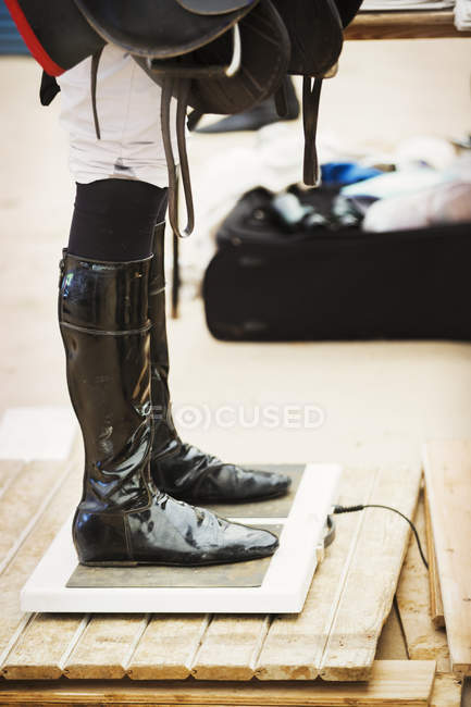 Rider wearing shiny black riding boots — Stock Photo
