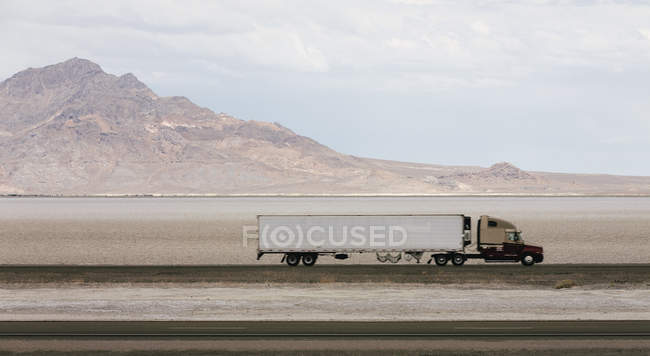 Lorry driving on road — Stock Photo