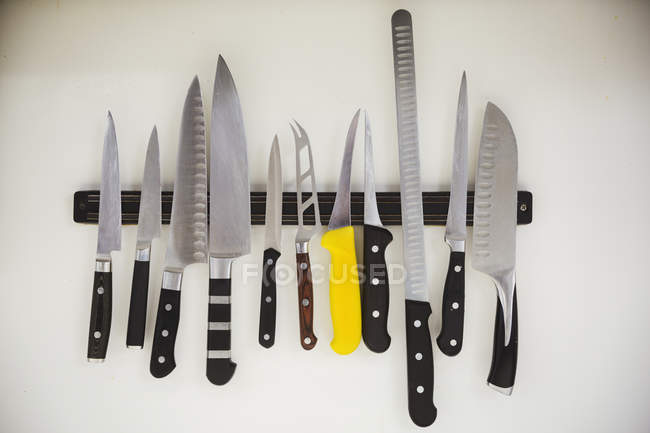 Selection of knives on a magnetic strip — Stock Photo