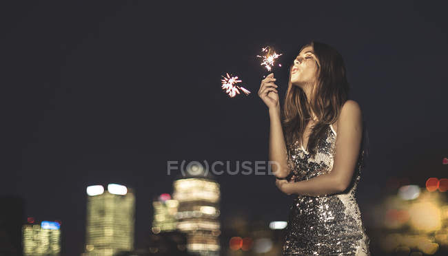 Young woman in sequined party dress — Stock Photo