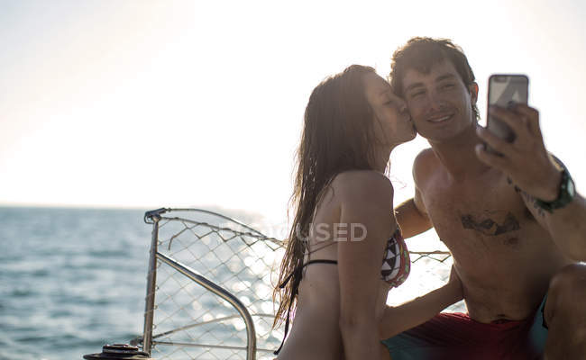 Man and woman on yacht — Stock Photo