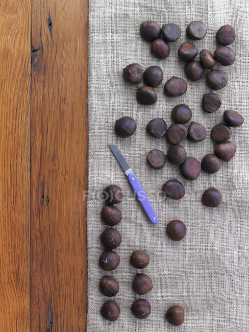 Chestnuts preparing for roasting — Stock Photo