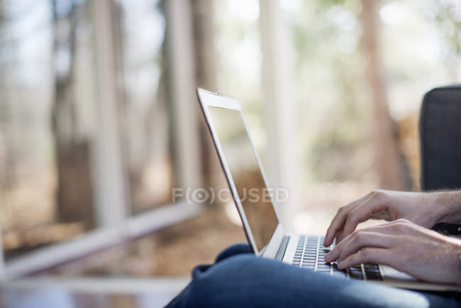 Close-up of male hands typing on laptop. — Stock Photo