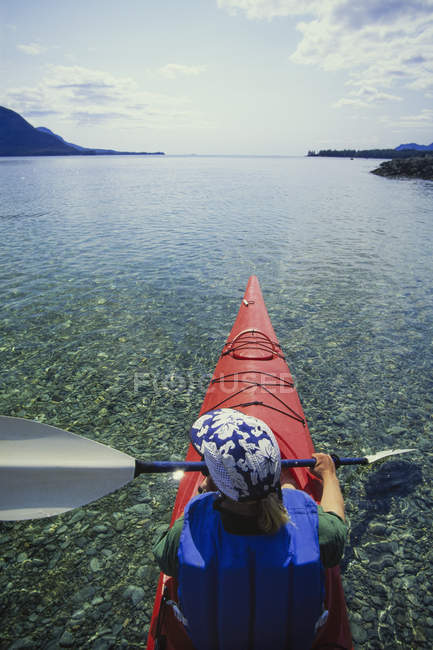 Man in sea kayak on calm water off shore of Ketchikan, Alaska, USA. — Stock Photo