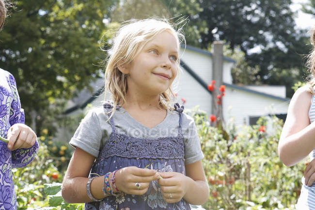 Elementary age girls standing together in country. — Stock Photo