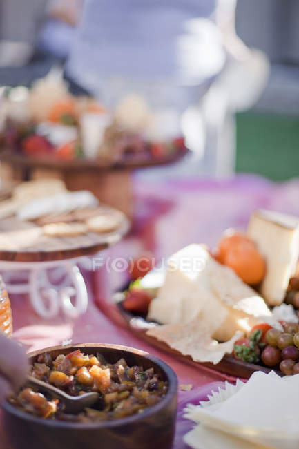 Table served with desserts and cheese board. — Stock Photo