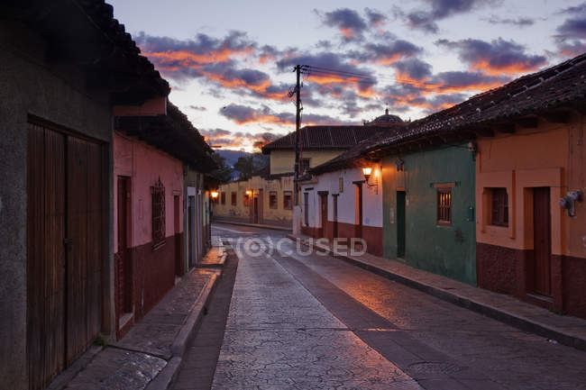 Empty town street at dawn under dramatic sky, Chiapas, Mexico — Stock Photo