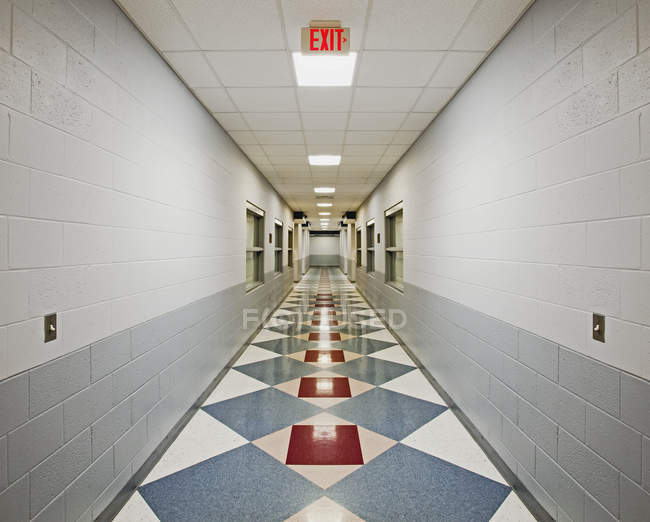 Hospital hallway with patterned floor and lights — Stock Photo