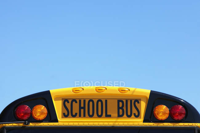 School bus rooftop against blue sky — Stock Photo