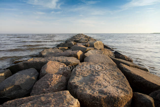 Rocky pier overlooking beautiful waterscape in Estonia — Stock Photo