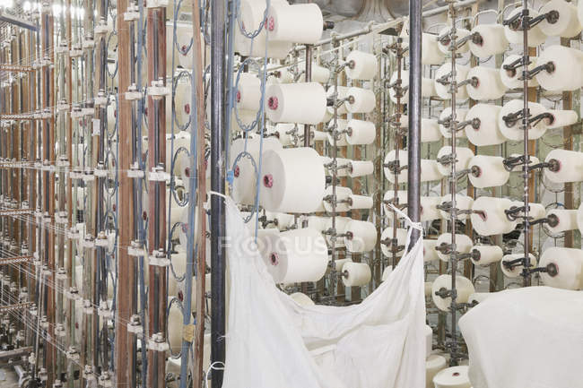 Spools in textile factory, Nikologory, Russia — Stock Photo