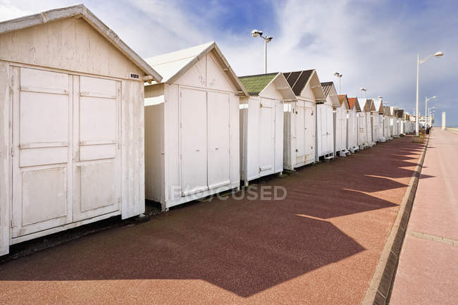 Beach huts by boardwalk in Normandy, France, Europe — Stock Photo