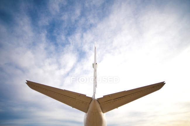 Tail of plane against cloudy sky in California, USA — Stock Photo