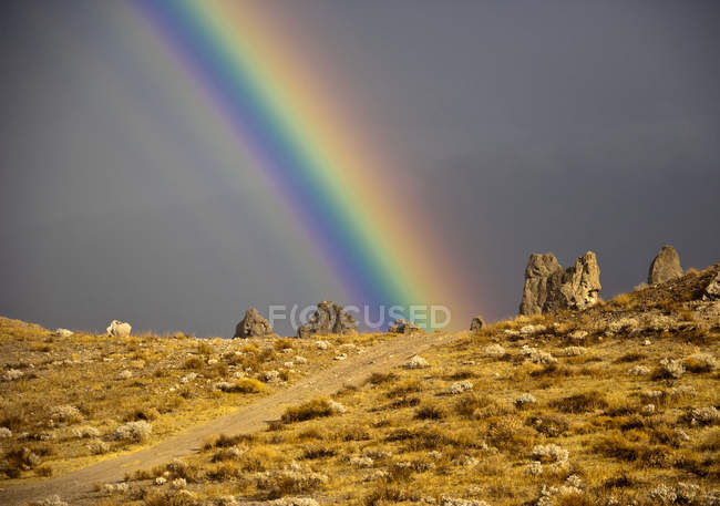 Rainbow and desert landscape in California, USA — Stock Photo
