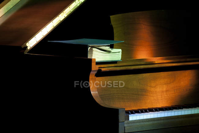 Music book on old piano, close-up — Stock Photo