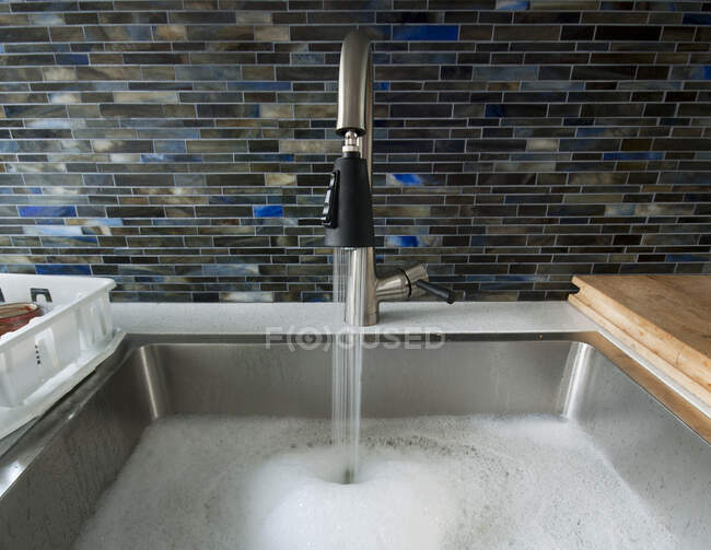 Kitchen Sink With Water, close-up view — Stock Photo
