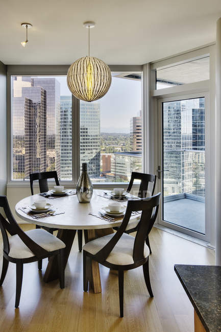 Dining room in luxury highrise apartment — Stock Photo