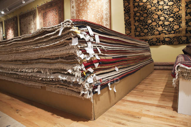 Stacked rugs in shop in Seattle, Washington, USA — Stock Photo