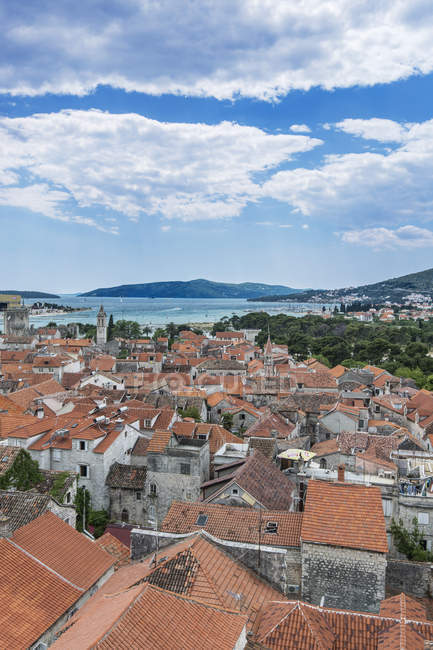 Aerial view of coastal city rooftops under cloudy sky, Trogir, Split, Croatia — Stock Photo