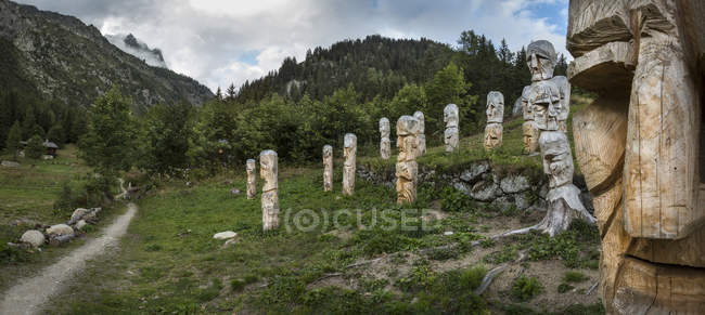 Carved totem poles on Mt Blanc trail, Argentiere, France — Stock Photo