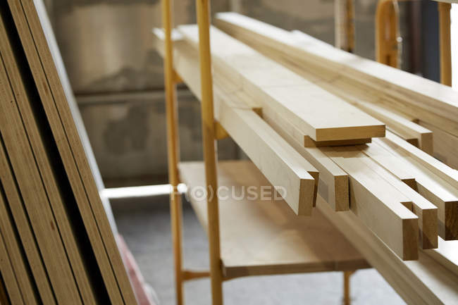 Planks of wood in industrial carpentry workshop — Stock Photo