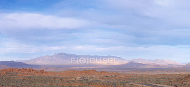 Clouds over mountain landscape, Moapa Valley, USA — Stock Photo