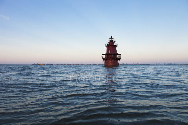 Lighthouse peering from blue ocean water, Chesapeake bay, Virginia, USA — Stock Photo