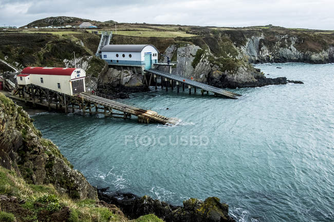 New and old boat houses, St Davids Lifeboat Station in St Justinian, Pembrokeshire, Wales, UK. — Stock Photo