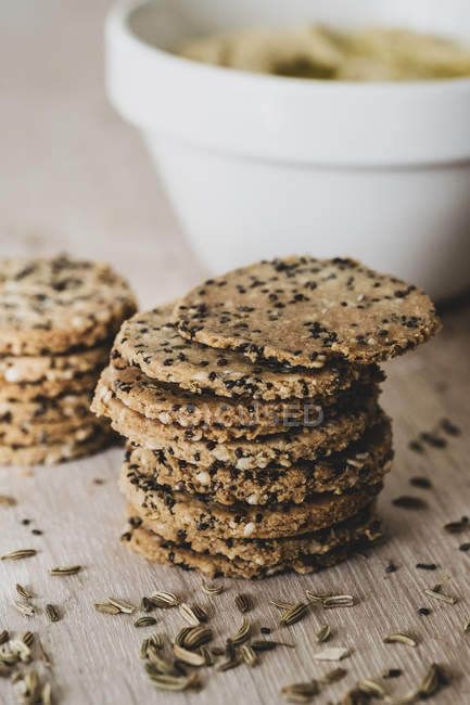 Close-up of stack of freshly baked seeded crackers. — Stock Photo