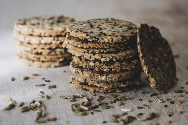 Close-up of stacks of freshly baked seeded crackers. — Stock Photo