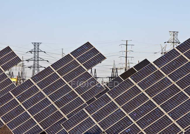 Solar panels and power lines and posts in Arizona, USA — Stock Photo