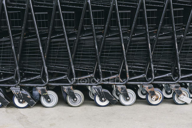 Supermarket carts stacked together, full frame. — Stock Photo