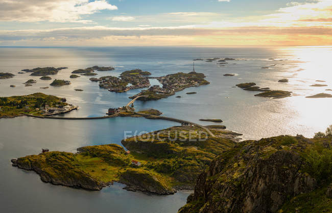 Henningsvaer on Lofoten islands with sheltered harbour and bridges connecting rocky islands, Norway, Europe. — Stock Photo