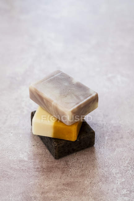High angle close-up of stack of homemade bars of soap. — Stock Photo