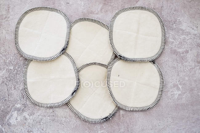 High angle close-up of homemade white cosmetic pads. — Stock Photo